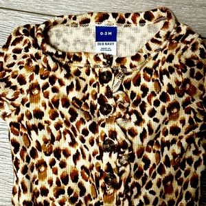 Leopard romper for a baby.